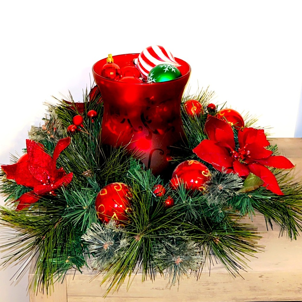 Cute Christmas table decor, wreath, vase, ornaments. Beautiful centerpiece